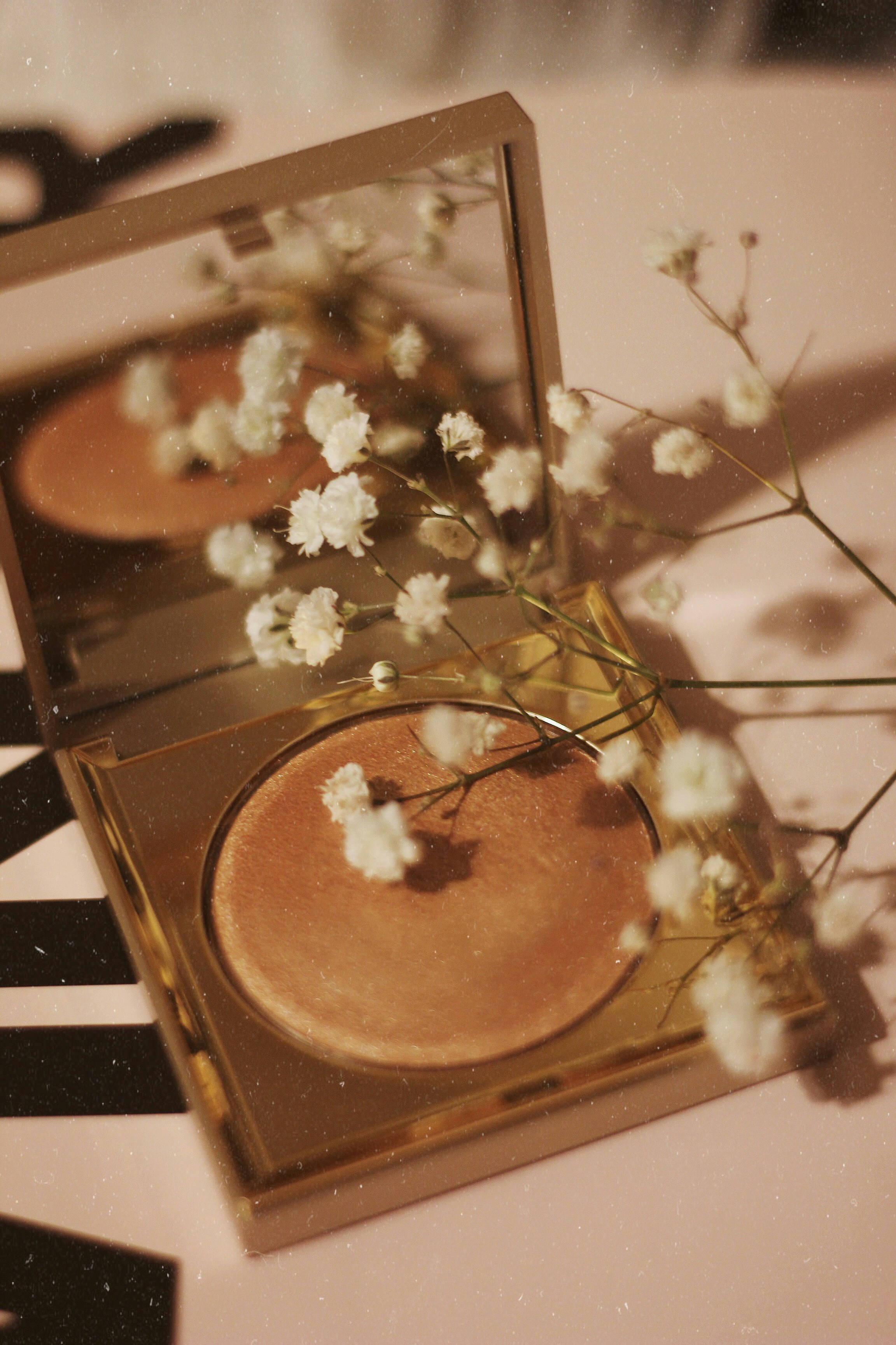Makeup products arranged aesthetically